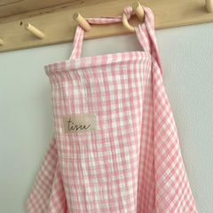 TISU nursing cover in pink gingham for discreet feeding on the go.