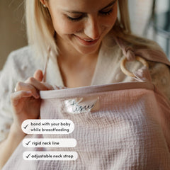 TISU nursing cover with arched neckline and adjustable strap for eye contact.