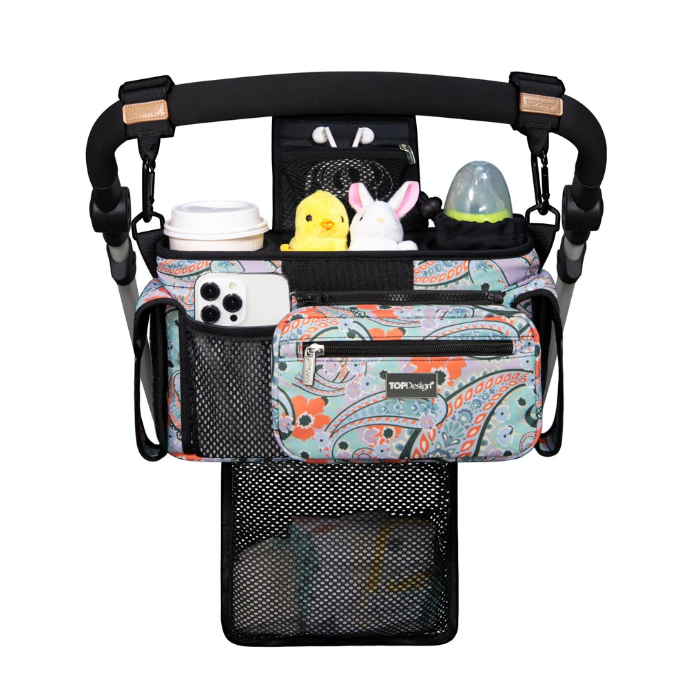 TopDesign universal stroller organizer in green bandanna keeps essentials within easy reach.