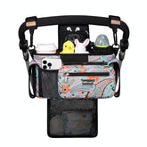 TopDesign universal stroller organizer in green bandanna keeps essentials within easy reach.