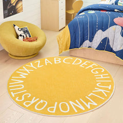 Topotdor Yellow Nursery Rug; 63-inch circle brightens bedrooms while cushioning crawlers.