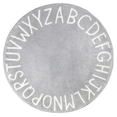 Topotdor round alphabet rug in grey offers a soft, safe surface for learning.
