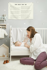 Topthink beige nursery banner decorates wall and complements kid-friendly styling.