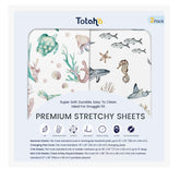 TotAha Sea Animal crib sheet folded, showing soft knit fabric for gentle nights.
