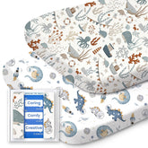 TotBASIC bassinet sheet with dino and whale pattern for gentle, cozy sleep in compatible bassinets.