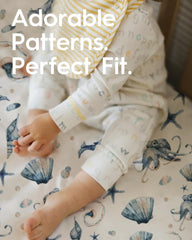 TOTBASIC crib sheet with elastic edge keeps sheet firmly in place.