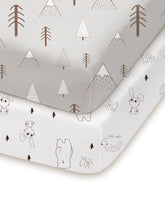 TotChill pack and play sheets in grey woodland design provide a cozy sleep surface.