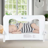 TotCraft bed rail front view on a queen bed showing secure toddler protection.