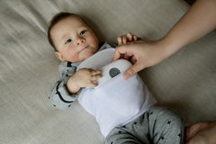 Tranquilo Baby Soothe wrap-around belly band keeps massager in place.