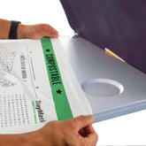TrayMask compostable tray table cover on airplane tray keeps surfaces clean