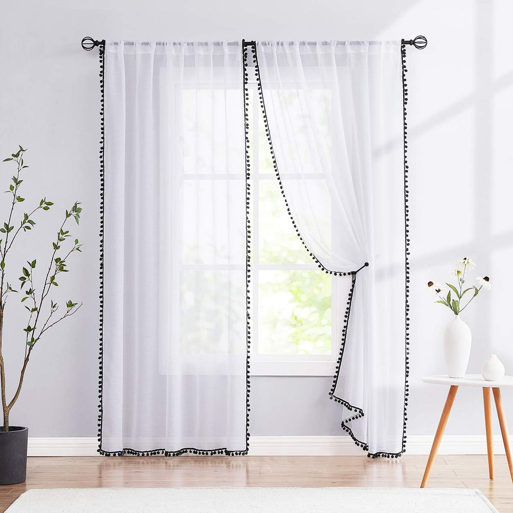 Treatmentex pom pom white sheer curtains panel close-up, airy finish for bright rooms.