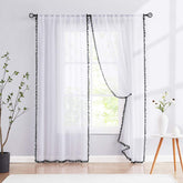 Treatmentex pom pom white sheer curtains panel close-up, airy finish for bright rooms.