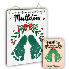 TRUMPETIC Baby's First Christmas footprint hanging sign makes a colorful memory keepsake.