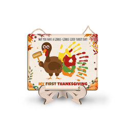 TRUMPETIC DIY little turkey handprint sign for baby's first Thanksgiving keepsake and fall decor.