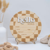 TTMerriwood Hello World baby announcement sign on checkered wood, ideal for newborn photos