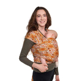 Tula Stretchy Tencel wrap in Sunflower; ultra-soft fabric for newborn bonding.