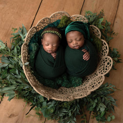 Twinkle Nest dark green waffle knit wrap shown as cozy newborn swaddle for shoots