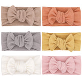 UeeSum baby headbands in soft-knit fabric, gentle on tiny heads for everyday wear.