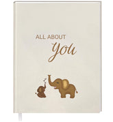 UM Novelties Baby's First Year Book cover shows minimalist design for a timeless keepsake