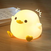 UNEEDE LED cute bean duck night light providing soft bedside glow for bedtime.