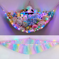 Unicorn Castle stuffed animals net hammock hanging in a kids' room, keeping toys organized and within reach.