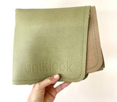 Uniklook leather changing pad closed for compact travel-ready design.