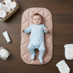 Uniklook quilted pad top view in rose shows waterproof surface for mess-free changes.