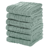 Unnivoll muslin baby washcloths six-pack in dark green for gentle baths.