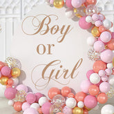 Unonede boy or girl sign decal on balloon arch backdrop for gender reveal