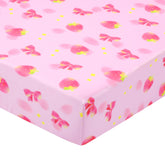 UOMNY Strawberry Bow crib sheet in a playful pattern for a cozy nursery.