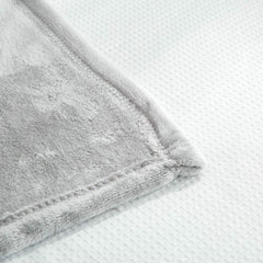 UOZZI BEDDING compact travel-friendly blanket shown folded for easy packing