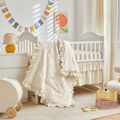 UOZZI BEDDING 2-inch ruffle edge elevates crib styling.