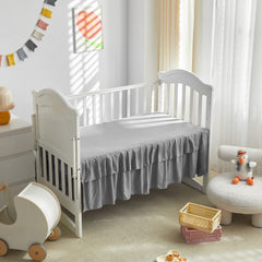 Three-piece crib bedding set: comforter, sheet, and skirt