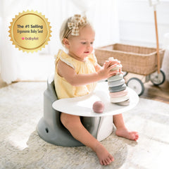 Upseat booster with tray keeps meals at comfortable height.