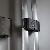 Urban August fridge lock closed on French doors demonstrating child safety