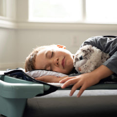 Urban Infant Tot Cot Nap Mat secret pocket holds a plush toy for comfort