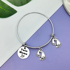 Closeup of Vadaka Twins Mama Jewelry design, delicate stainless steel.