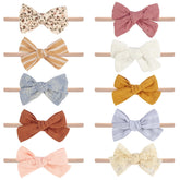 VISBL baby headband with pink lace bow for gentle newborn photos