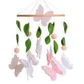 Vlokup butterfly mobile for crib in pink and white enhances visual focus.