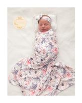 Vollmic newborn swaddle blanket in ink pink shows stretchy knit for easy wrapping.