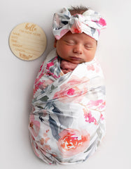Vollmic newborn swaddle fabric close-up in pink floral leaf knit.