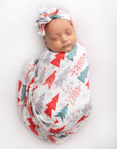 Vollmic newborn swaddle in red tree pattern laid flat for a cozy look.