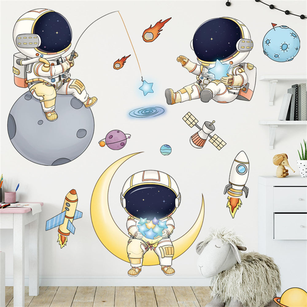 WAFT YEARN astronaut wall decal adds playful space scenery to nurseries.