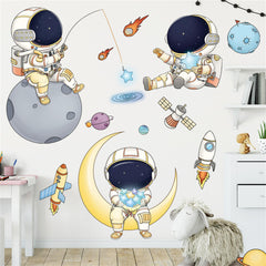 WAFT YEARN astronaut wall decal adds playful space scenery to nurseries.