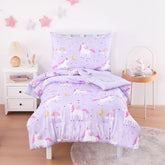 Wake In Cloud 4-piece bedding set on toddler bed featuring unicorn rainbow stars.