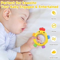Baby holds Walulan teether ring during playtime for teething relief