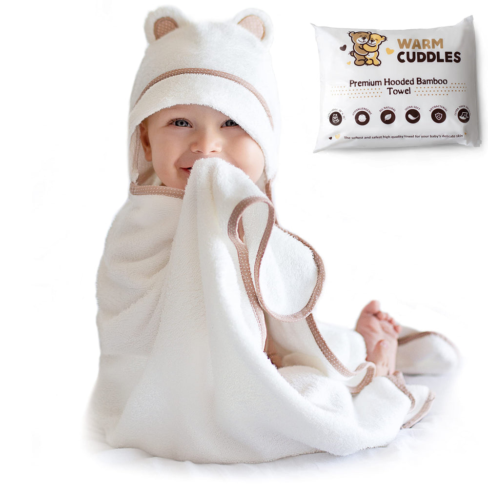 Warm Cuddles premium hooded towel in white, plush softness for gentle post-bath drying.