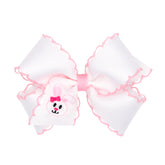 Wee Ones Easter bow with Moonstitch edge for a delicate festive look.