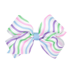 Wee Ones Easter bow on Wee Stay clip keeps hair secure during activities.