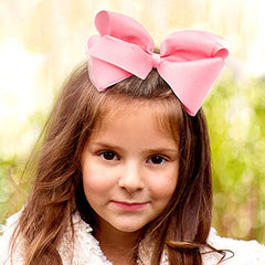 Grosgrain ribbon texture adds subtle shine on light pink bow.